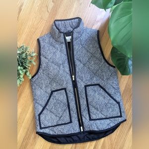 Black and white herringbone puffer vest